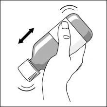 A hand holding a bottle
Description automatically generated