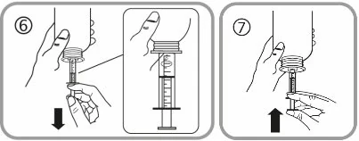 A close-up of a syringe being filled with liquid
Description automatically generated