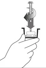 A hand holding a device with a thermometer
Description automatically generated